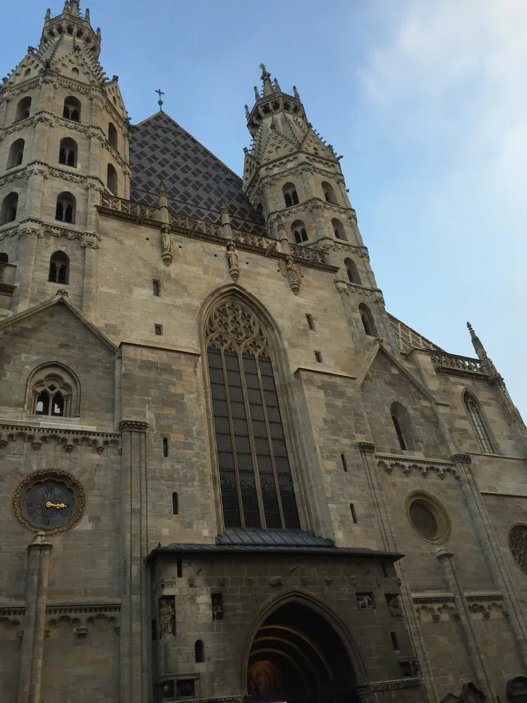 The Romanesque west front with its two Heathen Towers and the Gothic south tower behind.