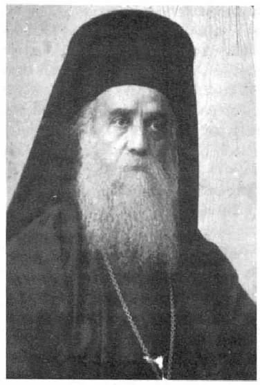 Black and white photograph of Nectarios in a monastic veil and cassock, with a long white beard and a pectoral cross.